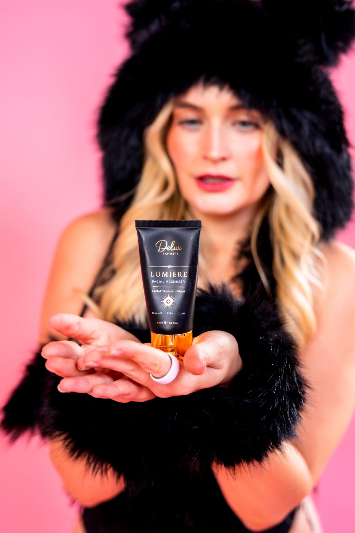 Lumiere facial maximiser held in open hands